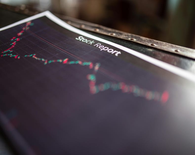 Stock report page with a line chart showing fluctuating stock prices on a dark background