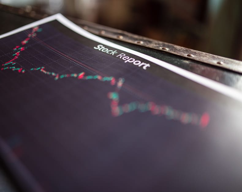 Stock report page with a fluctuating red‑green line chart of stock prices.
